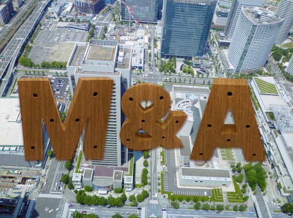 M＆Aの文字とオフィス街