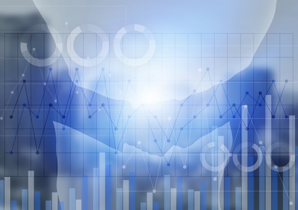 棒グラフと握手するビジネスマン